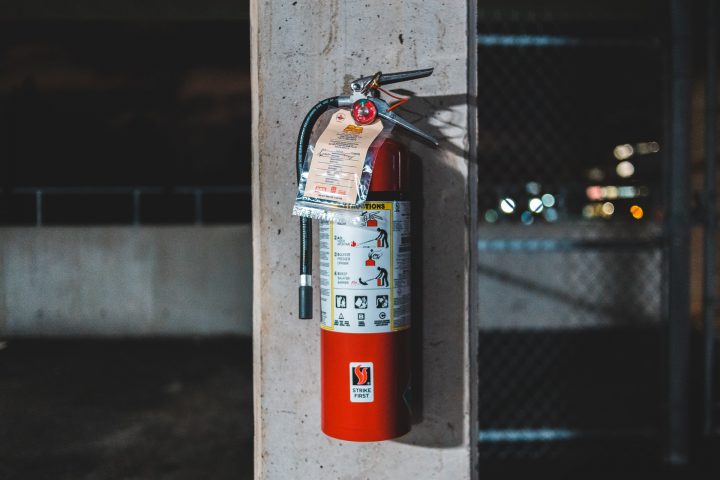 fire extinguisher on concrete column